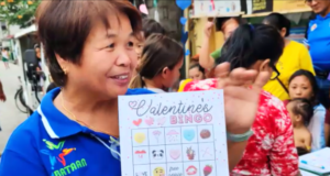 Rural health midwife Lolita Elvambuena Poblete shows V-Day bingo card. Photo: Ernie Esconde